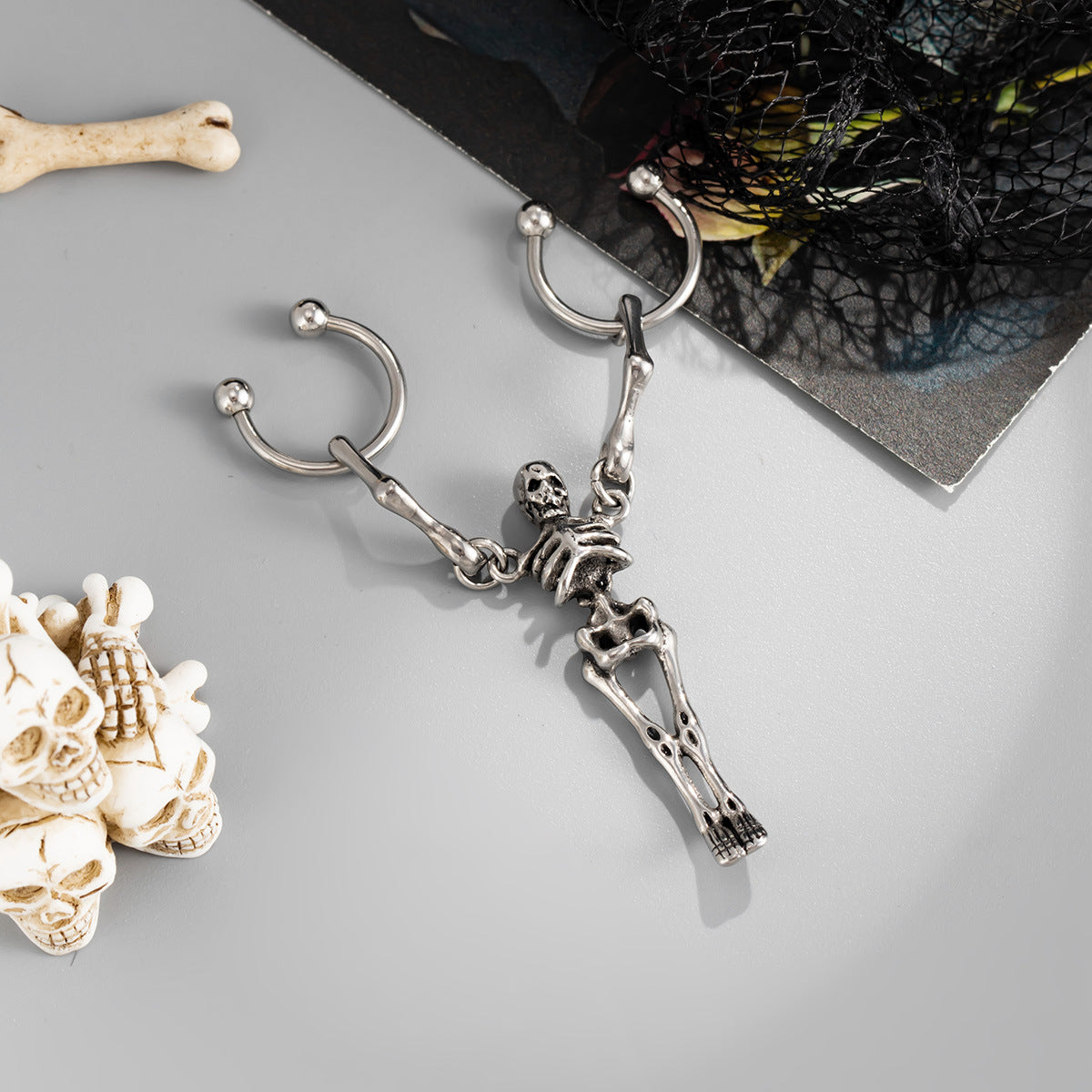 Wholesale Sweet and cool titanium steel skull ear bone earrings